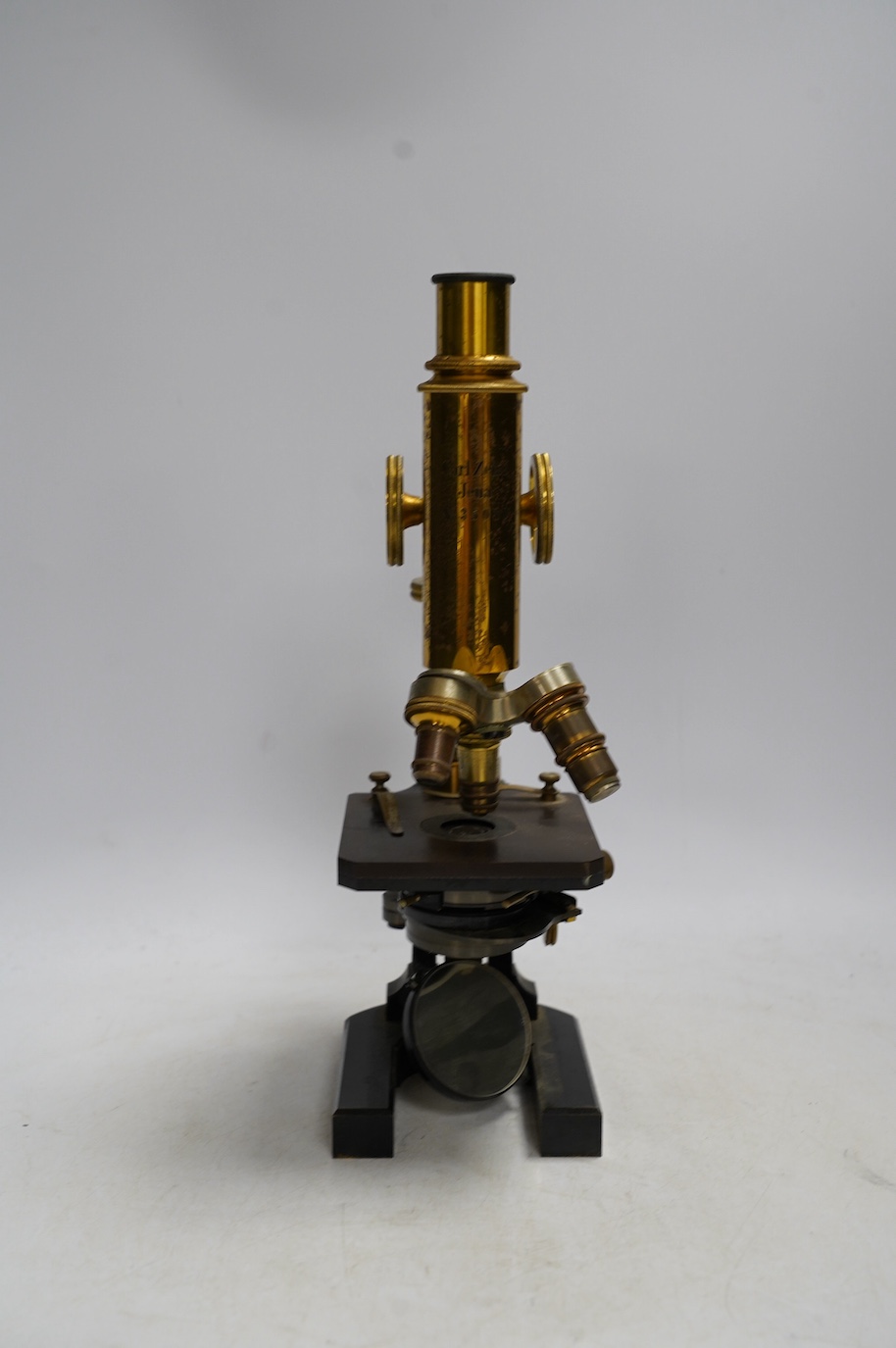 A Carl Zeiss microscope, detailed by Baker 244 High Holborn, London, in a fitted mahogany cased with alternative lenses, etc., case 38cm. Condition - fair to good